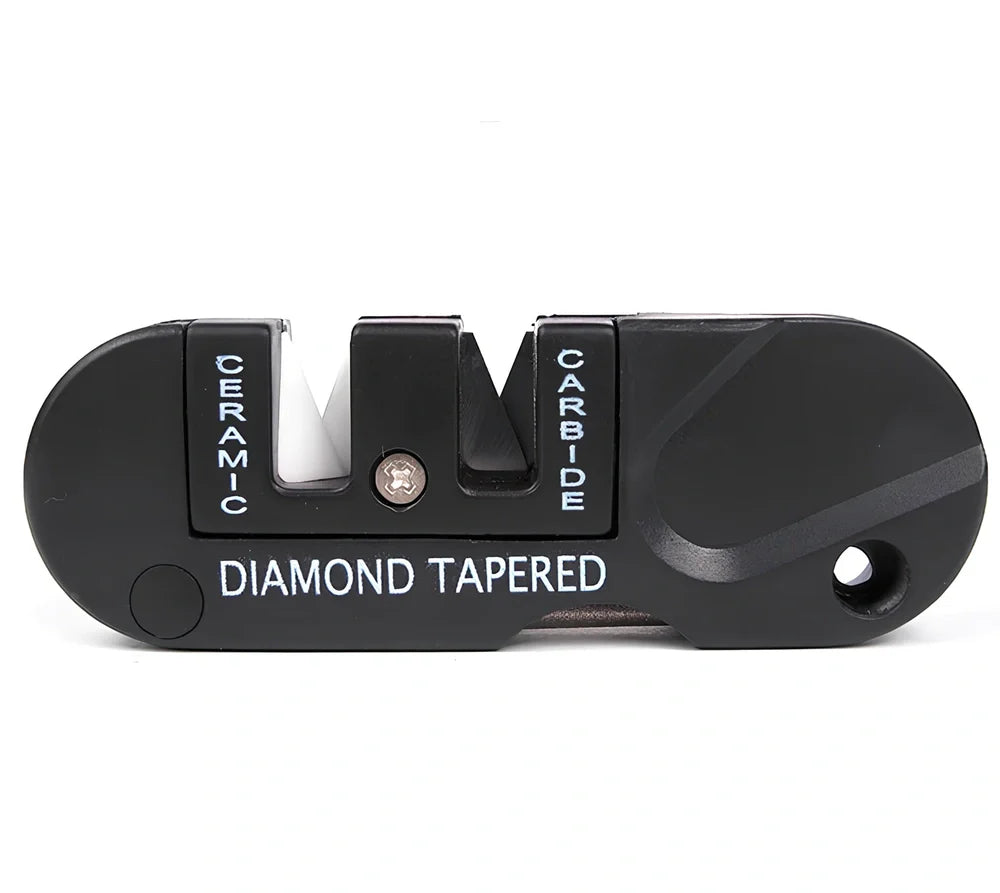 Black Pocket Pal knife sharpener showing carbide blades, ceramic stones, and tapered diamond rod on 3.5-inch compact unit