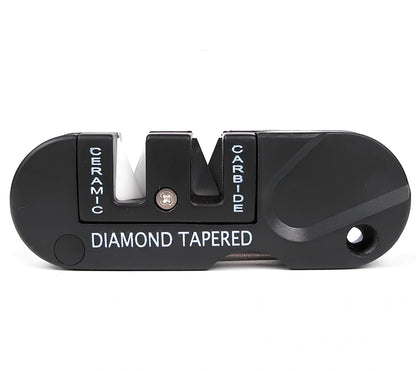 Black Pocket Pal knife sharpener showing carbide blades, ceramic stones, and tapered diamond rod on 3.5-inch compact unit