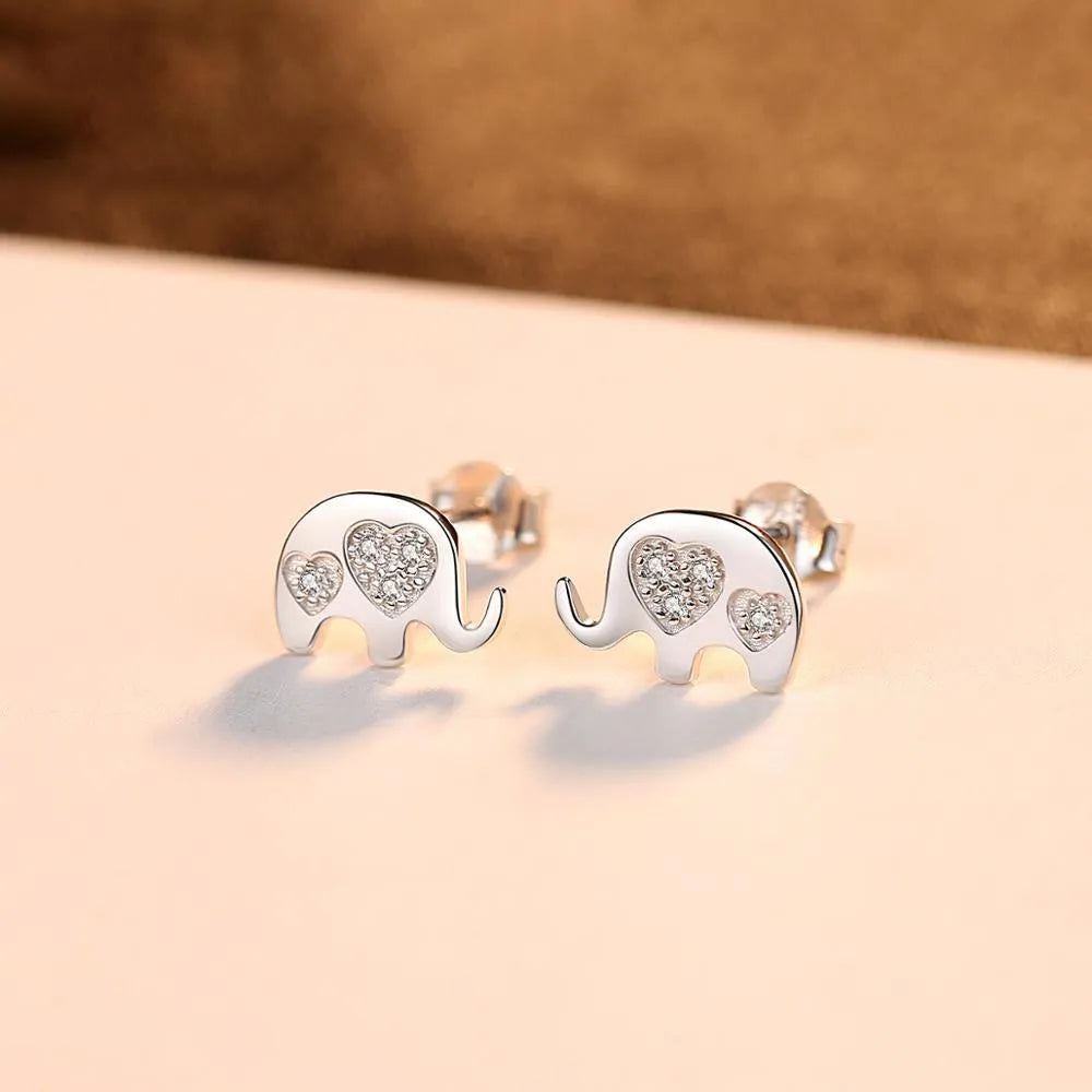 Small geometric silver earrings with gemstone setting in gold and silvery finishes