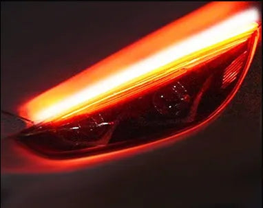 Car LED daytime running light strip with flowing turn signal function in silicone housing