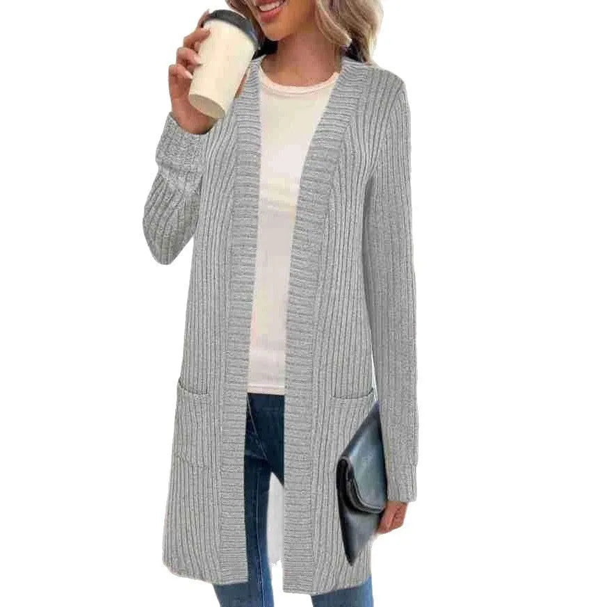 A loose-fit long sleeve knitted cardigan jacket with pockets, shown in black, grey, or wine red.