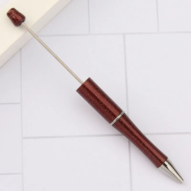 Rotating bead ballpoint pen in gradient colour with ABS plastic and steel wire construction