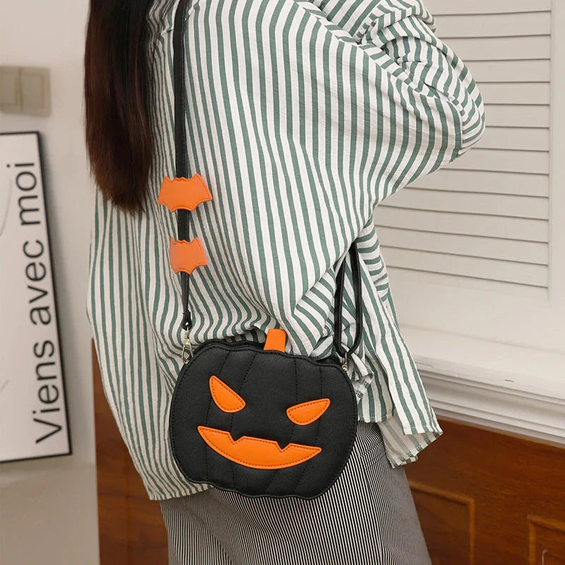 Stylish Halloween crossbody bag with pumpkin cartoon and bat design, available in multiple vibrant colors
