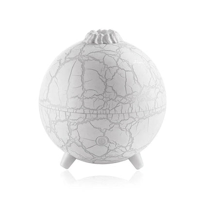 Stylish USB humidifier with essential oil diffuser, color-changing lights, and compact design for home or office use