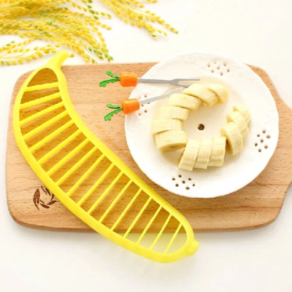 Yellow food grade PP banana cutter, 25 cm long, slices entire fruit in one quick motion for easy kitchen prep