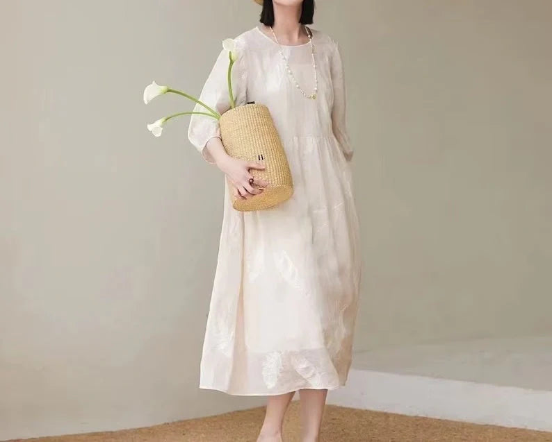 Women's white linen dress for summer, showcasing breathable and lightweight design