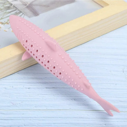 Green fish-shaped silicone cat chew toy with side holes, shown disassembled to reveal hollow interior for catnip.