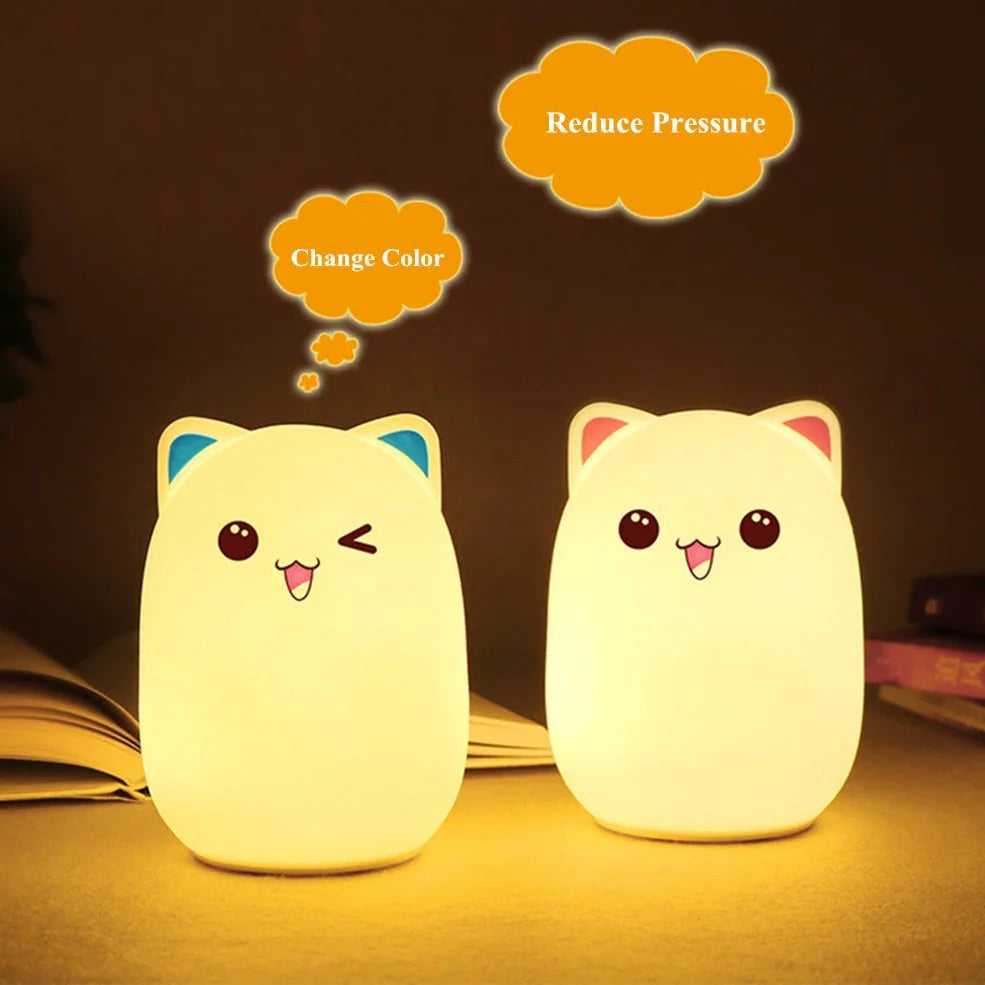 Cartoon silicone night lamp with clap activation in blue or pink, dimensions 100x100x135mm