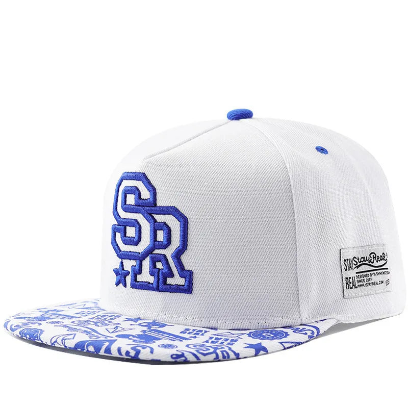 Cotton baseball hat with letter embroidery showing dome crown and adjustable strap in black and white colour options
