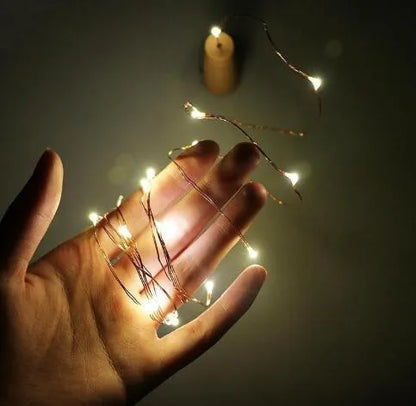 Copper wire LED string light with 20 bulbs wrapped around wine bottle for decorative lighting