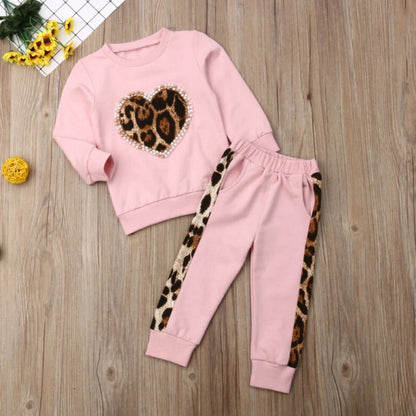 Pink cotton print sweatshirt and matching pants two-piece set with Asian sizing chart showing measurements