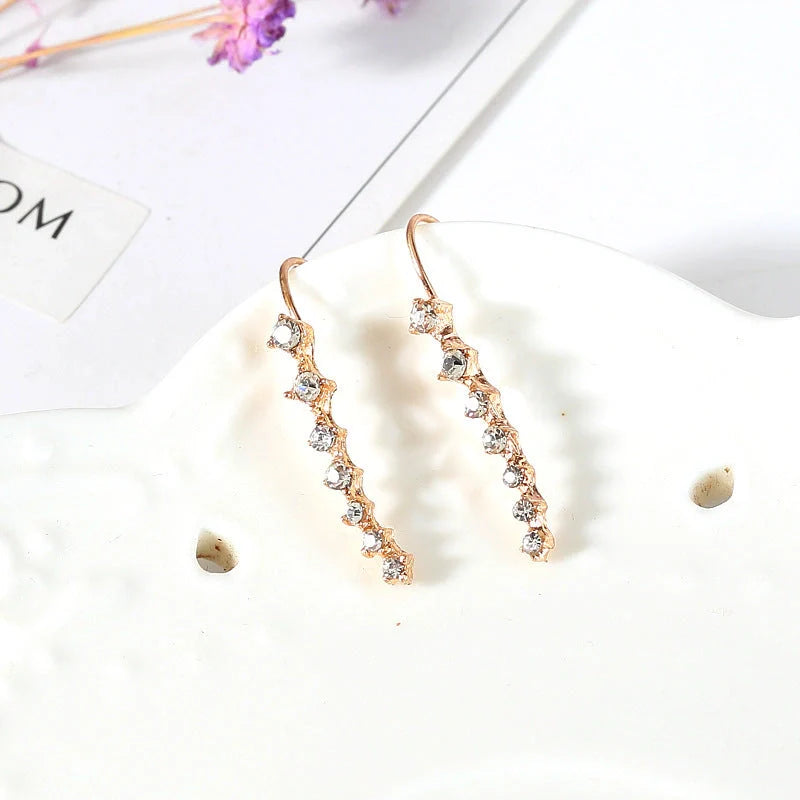 Elegant 7-inch rhinestone bridal earrings sparkling on a white background