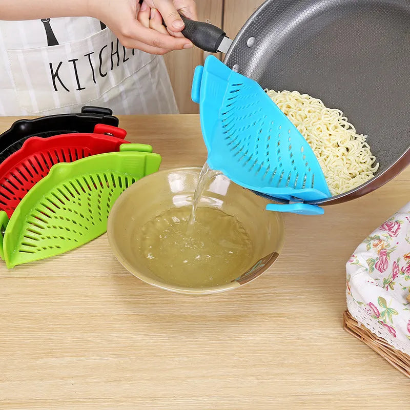 Silicone clip-on kitchen strainer with stainless steel frame attached to pot rim