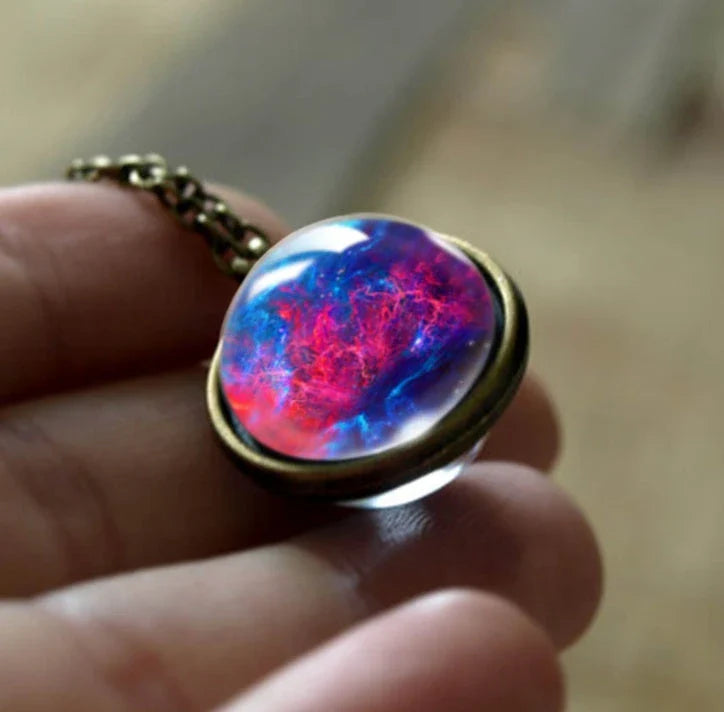 Mesmerizing double-sided galaxy pendant necklace in various celestial patterns and colors