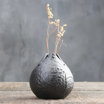 Handmade stoneware Zen Chinese flower arrangement vase with floating lotus device on wooden table