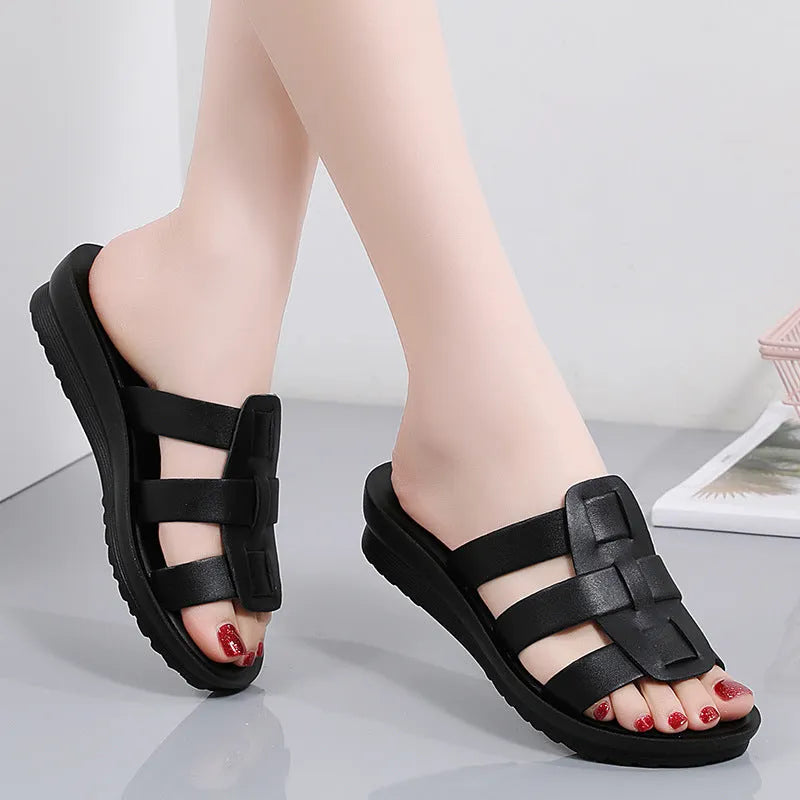 Women's large size flat bottom slippers in beige, black and brown colours with PU leather construction