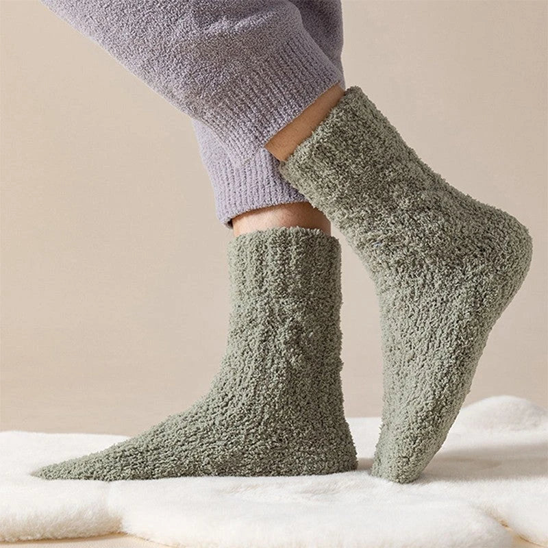 Cozy coral fleece socks in various colors, designed for superior comfort and warmth