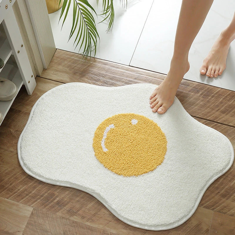Stylish and functional egg-shaped area rug with a playful design, perfect for adding charm and protecting floors in your home.