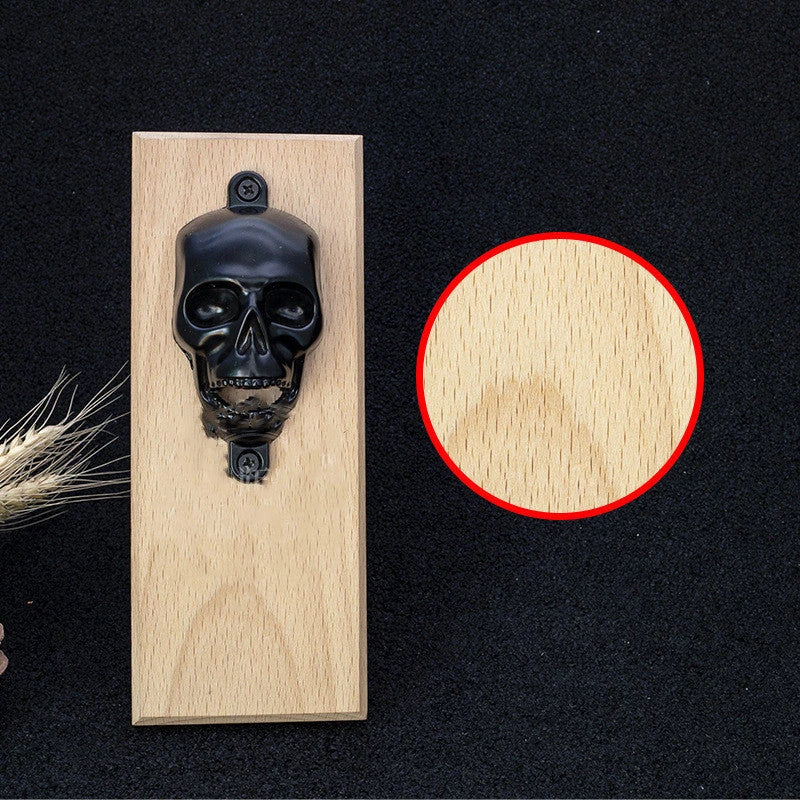 Stylish skeleton-shaped magnetic bottle opener with sleek black finish and solid wood base
