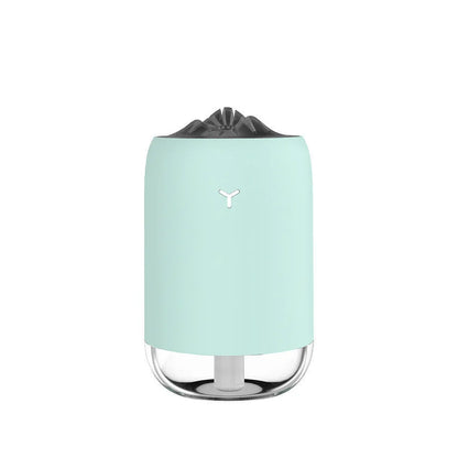 Compact cylindrical USB humidifier with night light in white, pink, or green, showing mist output.