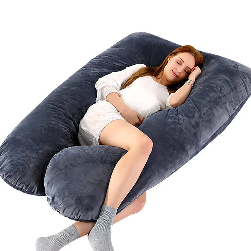 Large U-shaped pregnancy support pillow with removable cover and abdominal support belt.