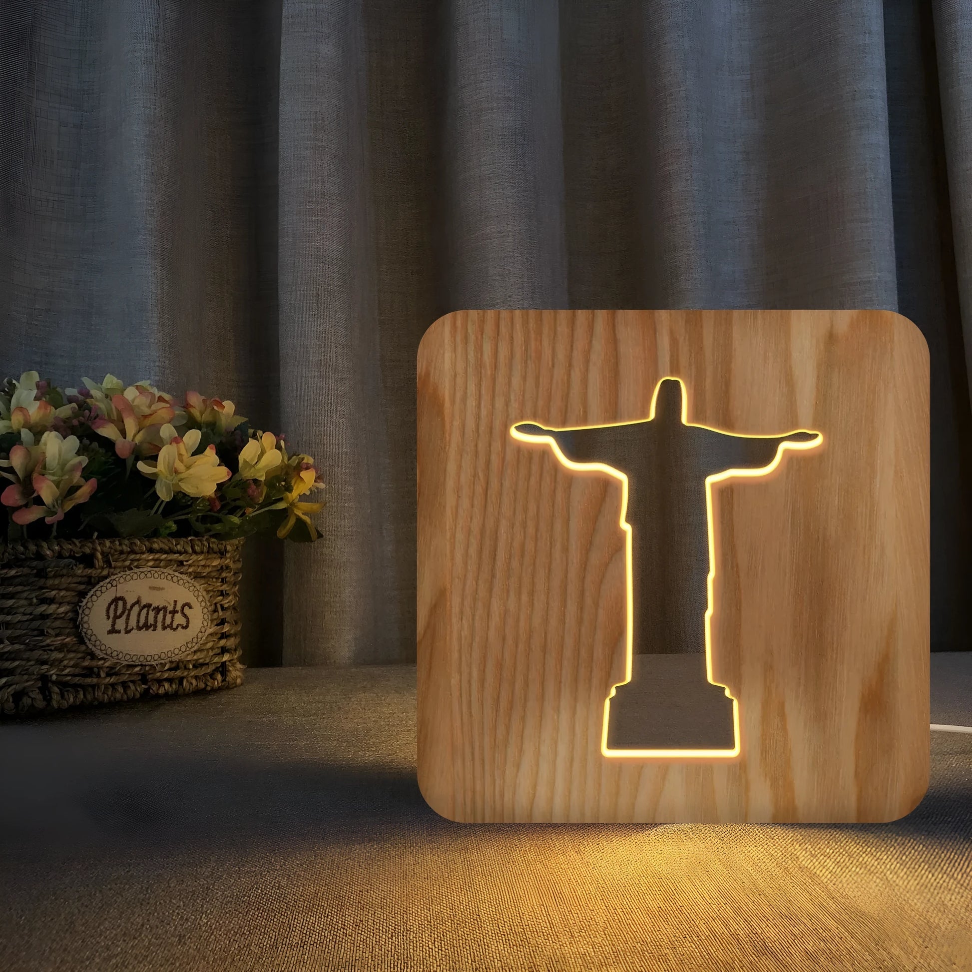 Solid wood hollow night lamp with warm white LED light on a surface