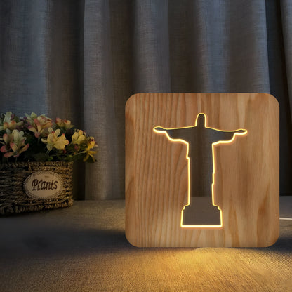 Solid wood hollow night lamp with warm white LED light on a surface