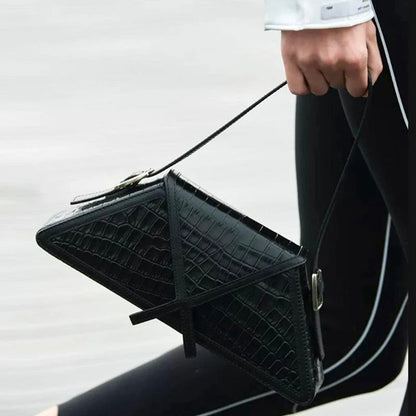 Stitching contrast trapezoid shoulder bag in black, beige, blue, and orange with magnetic buckle closure