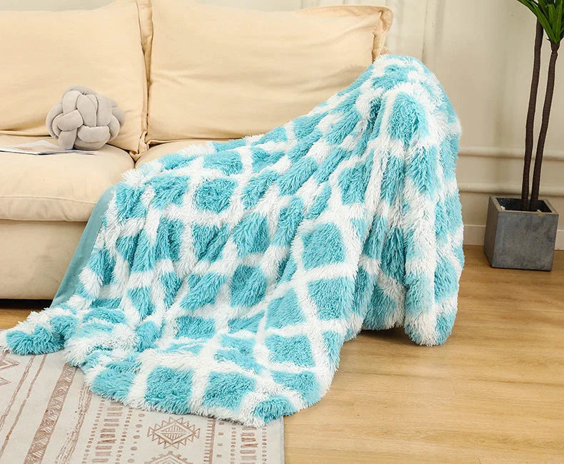 Soft, plush sherpa throw blanket in a variety of colors and sizes, perfect for cozy relaxation on the sofa or bed