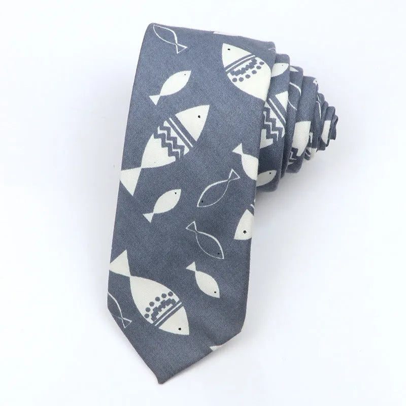 A narrow Korean-style cotton bow tie featuring a cartoon print, shown in a selection of colours.