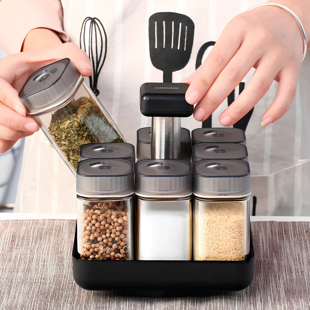 Six clear glass spice jars with natural bamboo lids in stackable configuration