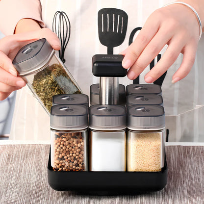 Six clear glass spice jars with natural bamboo lids in stackable configuration