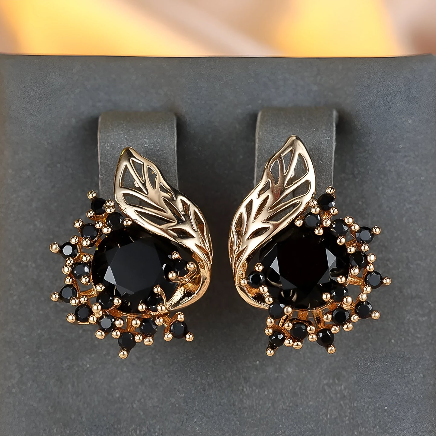 Round flower and feather design earrings in champagne gold with a choice of coloured zircon stones.