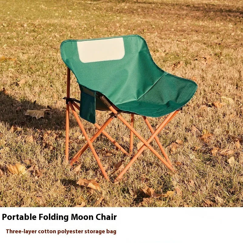 Portable folding camping chair with steel frame and Oxford fabric in outdoor setting