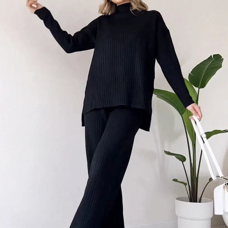Women's turtleneck knitted suit set with loose split design and straight trousers in white, black, and green