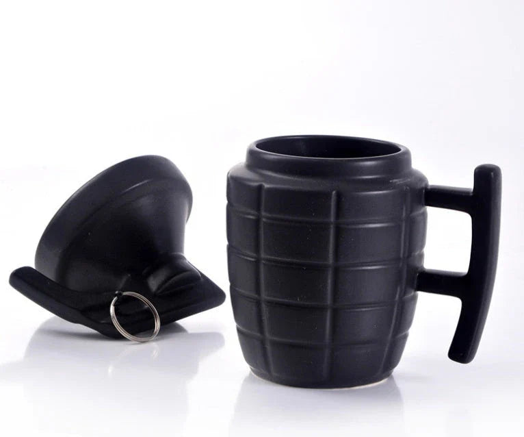 A white or black ceramic coffee mug with a grenade-inspired design and a secure lid for on-the-go convenience.