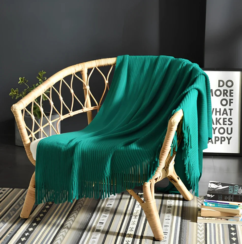 130x150cm knitted acrylic blanket with 10cm fringe detailing in beige colour draped over sofa