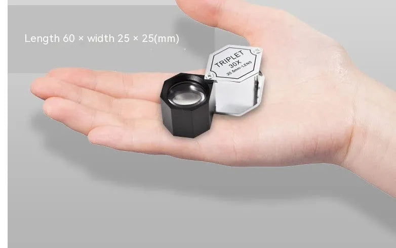 Handheld metal and optical glass magnifying glass for jewellery, stamp, and coin identification with 10x to 30x magnification.