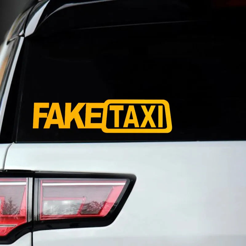 Waterproof FAKE TAXI car sticker in black, 20cm by 8cm, on a vehicle window.