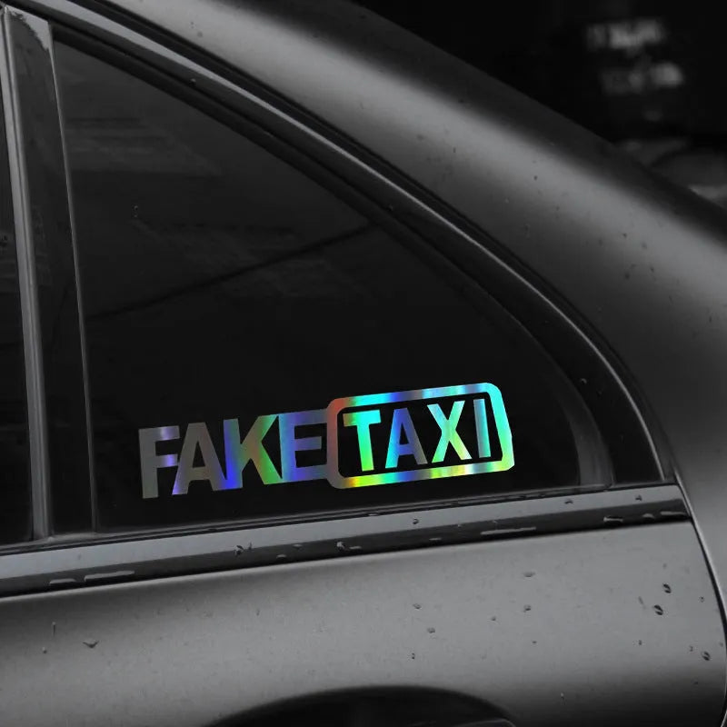 Waterproof FAKE TAXI car sticker in black, 20cm by 8cm, on a vehicle window.
