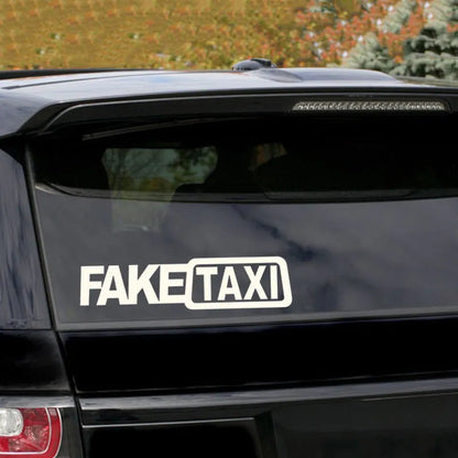 Waterproof FAKE TAXI car sticker in black, 20cm by 8cm, on a vehicle window.