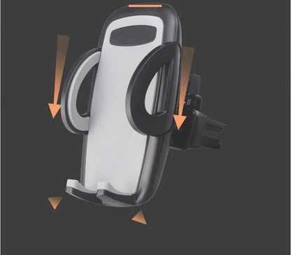 Black plastic mobile phone holder attached to a car air conditioning vent.