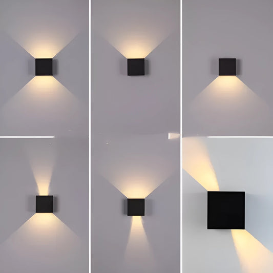 Black aluminium alloy wall lamp with 360-degree light output mounted on a corridor wall