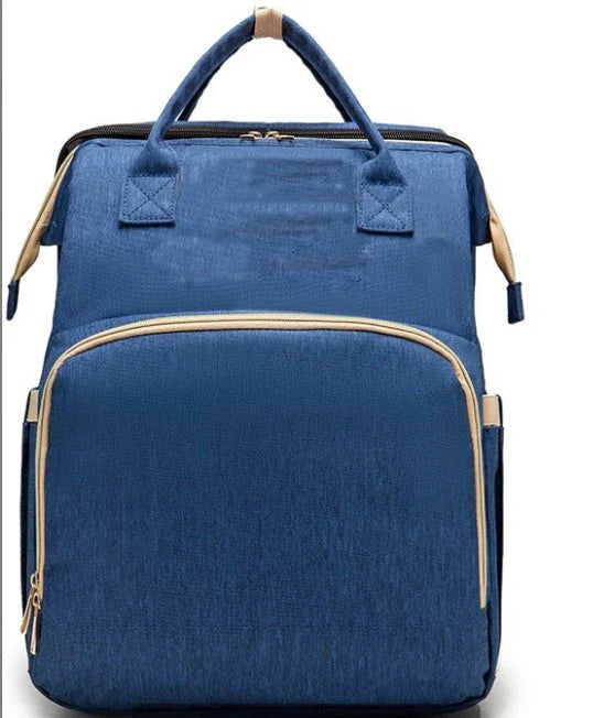 Versatile baby changing backpack with USB charging port and folding portable bed