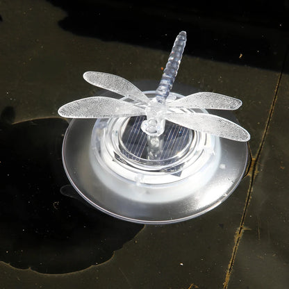 Solar LED float lamp with butterfly design floating on garden pond water surface