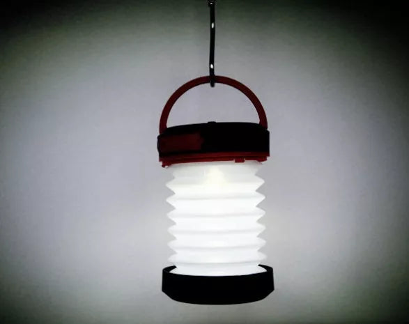 SolarBoom Collapsible Lantern with solar panel and USB charging port in green