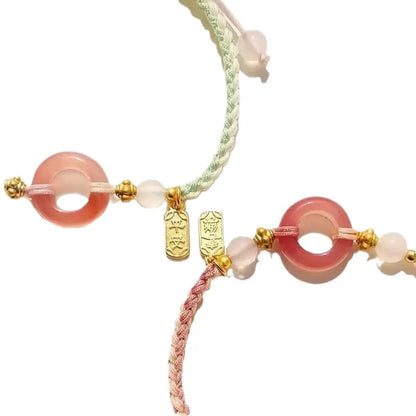 DIY woven watch band in peach blossom colours with national style pattern