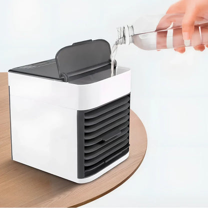 Desktop air conditioner fan with USB cable and water tank showing 7-colour LED lighting and mechanical control dial