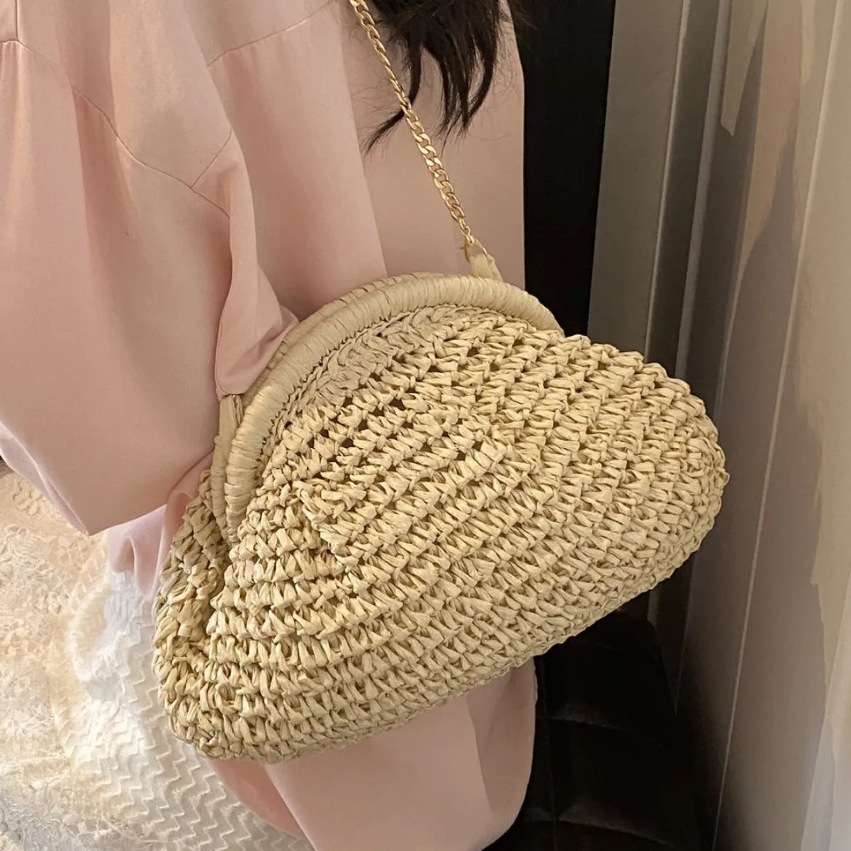 Women's paper straw beach shoulder bag in khaki colour with chain decorative elements