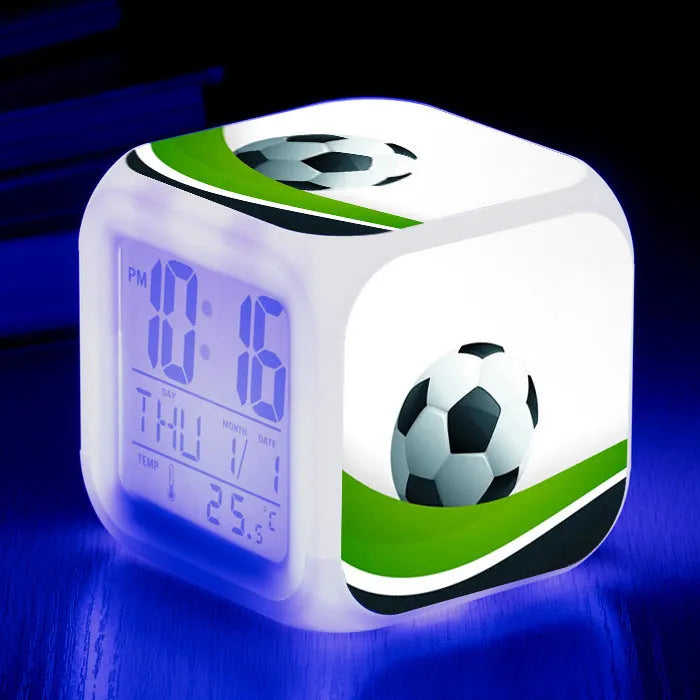 Colourful cartoon football pattern children's mute alarm clock on a table.
